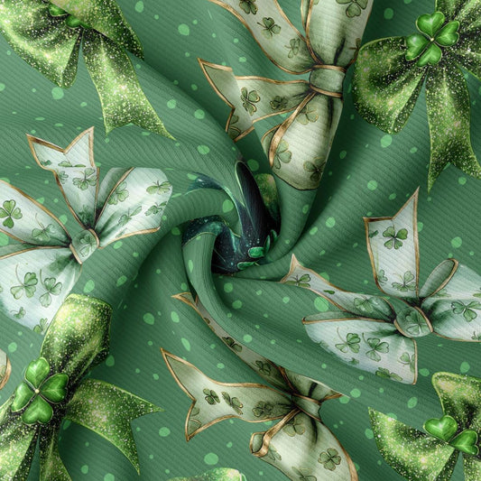 a green and white fabric with bows and shamrocks