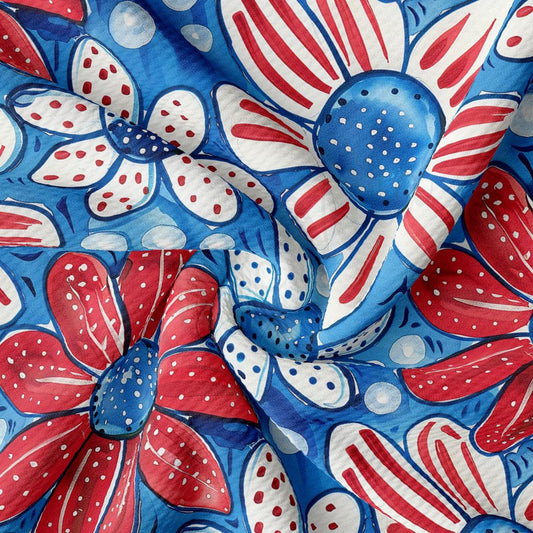 a red, white and blue flower on a blue background