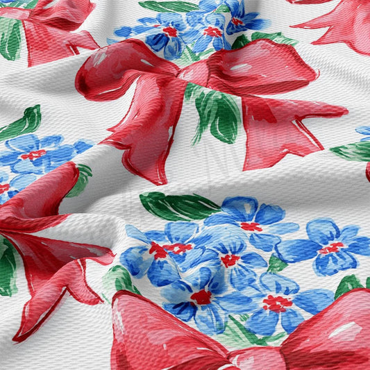 a red bow on a white background with blue flowers