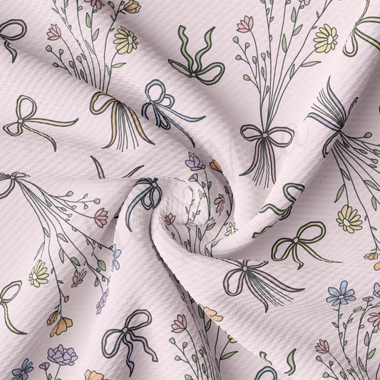 a close up of a white fabric with a flower pattern