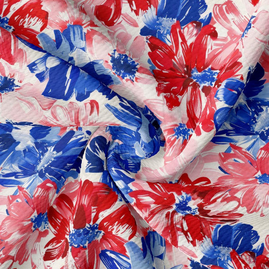 a red, white and blue floral print fabric