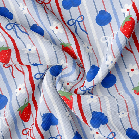 a red, white and blue striped fabric with a strawberry on it
