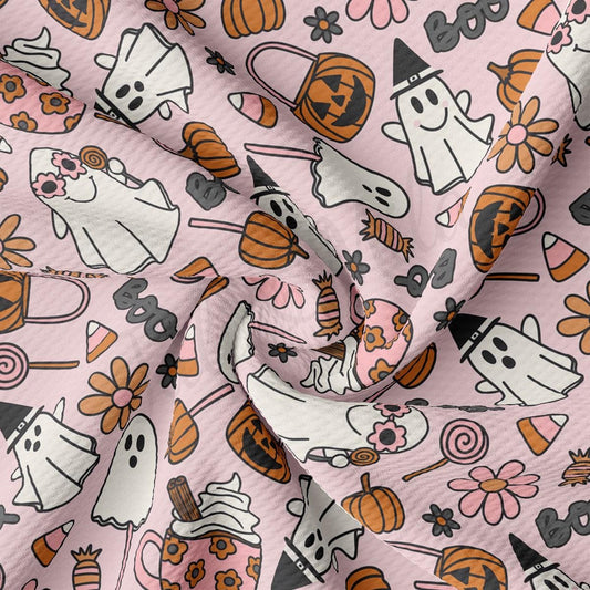 a pink background with a lot of halloween items on it