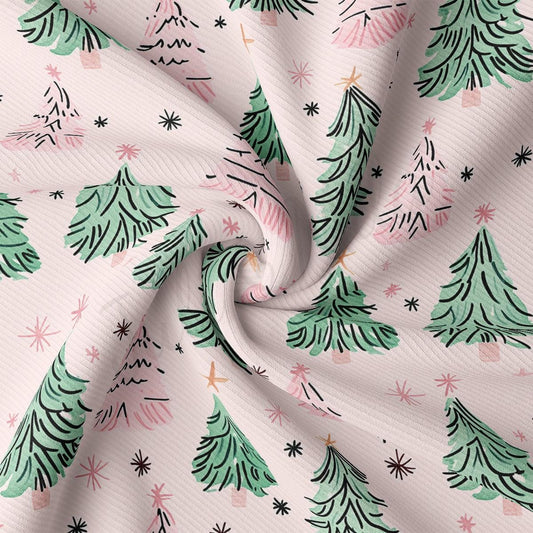 a close-up view of a fabric with a repeating pattern of stylized Christmas trees in shades of pink and green, along with small white stars scattered throughout the fabric.