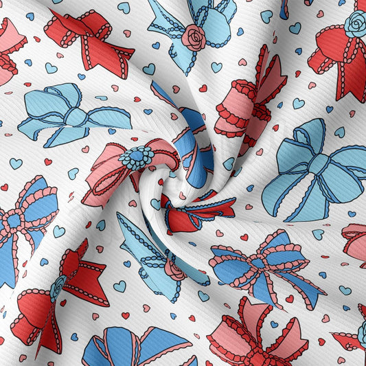 a red, white, and blue pattern of bows and hearts