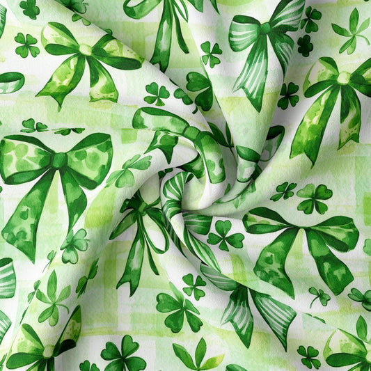 a green and white background with shamrock leaves