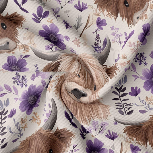a close-up view of a fabric with a repeating pattern of brown and white animal heads, along with purple flowers and leaves.
