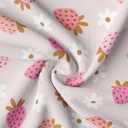 a close up of a pink and brown strawberry print fabric
