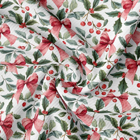 a close-up view of a fabric with a repeating pattern of red bows, holly leaves, and red berries. The pattern is intricate and detailed, creating a visually appealing and festive design.
