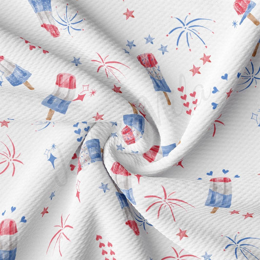 a white fabric with red, white and blue fireworks
