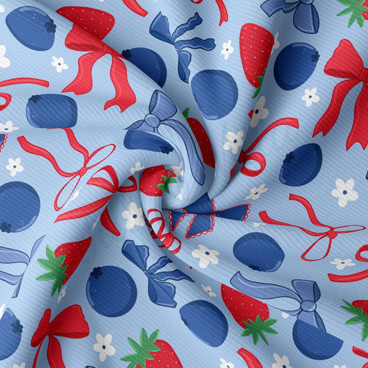 a close up of a blue fabric with strawberries on it
