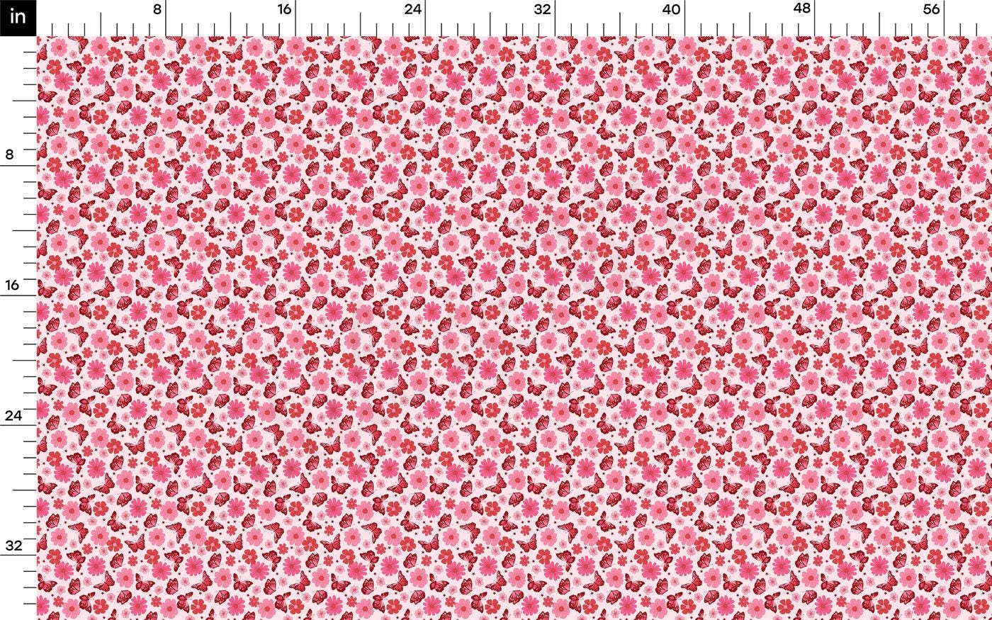 a pink and red flowered background with a ruler