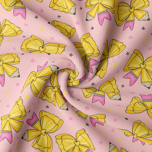 a fabric with a repeating pattern of yellow bows and pink pencils on a pink background.