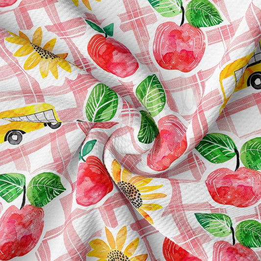 a pattern of apples, sunflowers, and a bus on a checkered