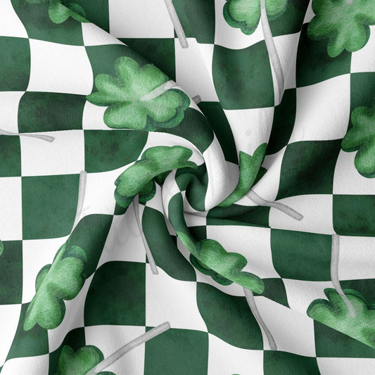 a green and white checkered fabric with shamrocks on it