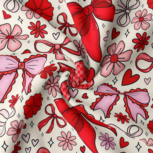 The image is a close-up of a fabric with a repeating pattern of red bows, flowers, hearts, and stars in various sizes and orientations.