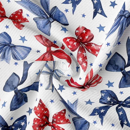 a red, white and blue pattern of bows on a white background