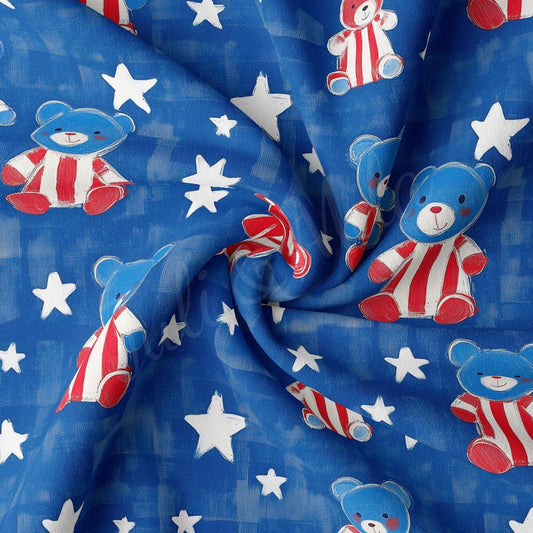 a blue fabric with stars and a teddy bear on it