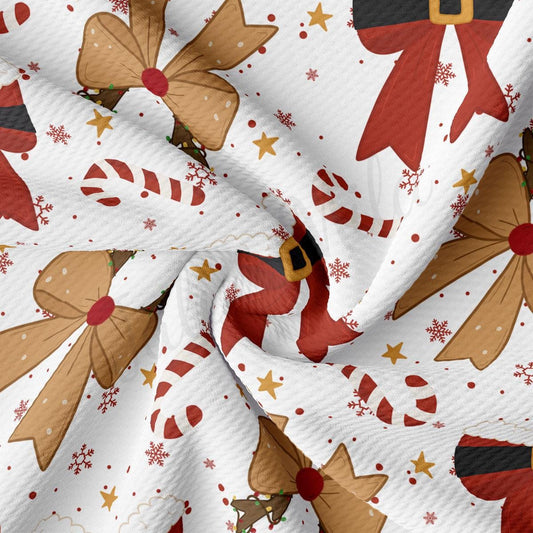 The image is a close-up of a fabric with a Christmas-themed pattern, featuring various shapes and designs such as bows, candy canes, snowflakes, and stars.