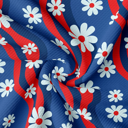 a red, white and blue fabric with flowers on it