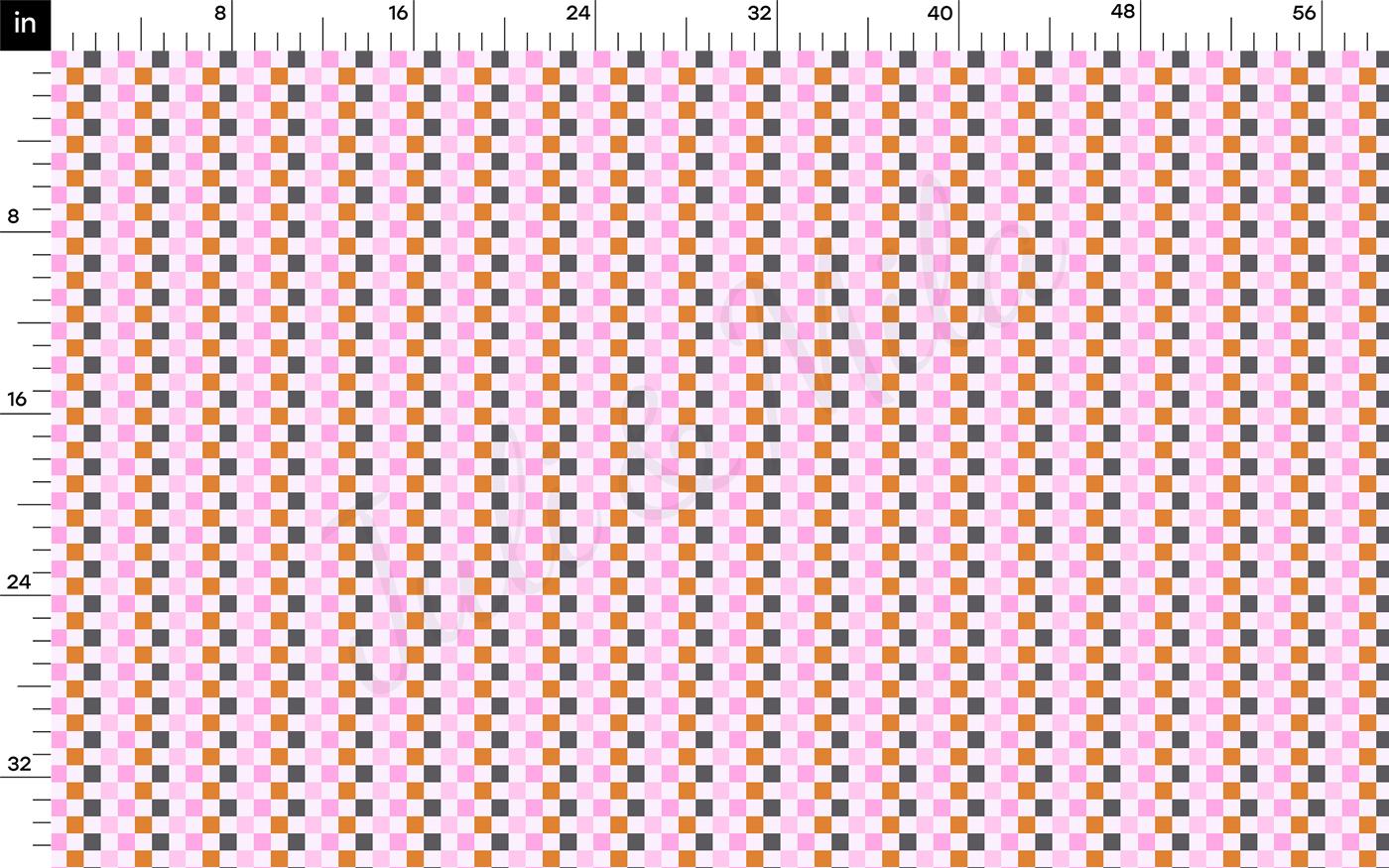 a ruler with a pink and grey checkered pattern on it