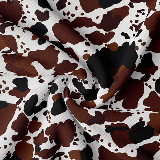 a brown and white camouflage print fabric