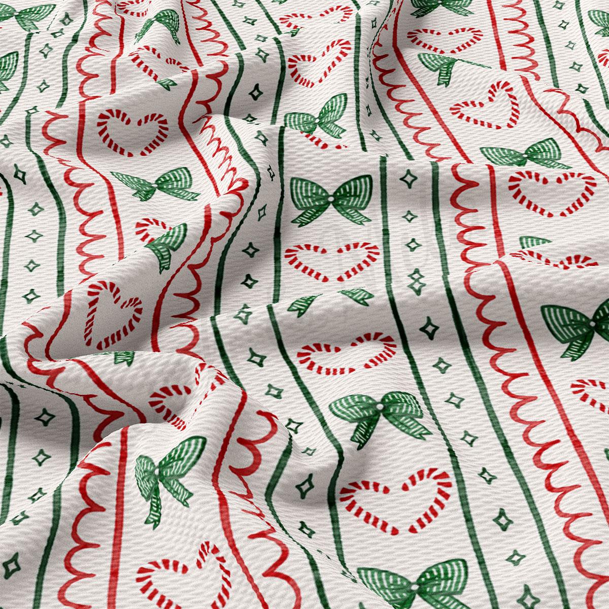 a close-up view of a fabric with a repeating pattern of red and green stripes, along with green and white hearts and candy canes.