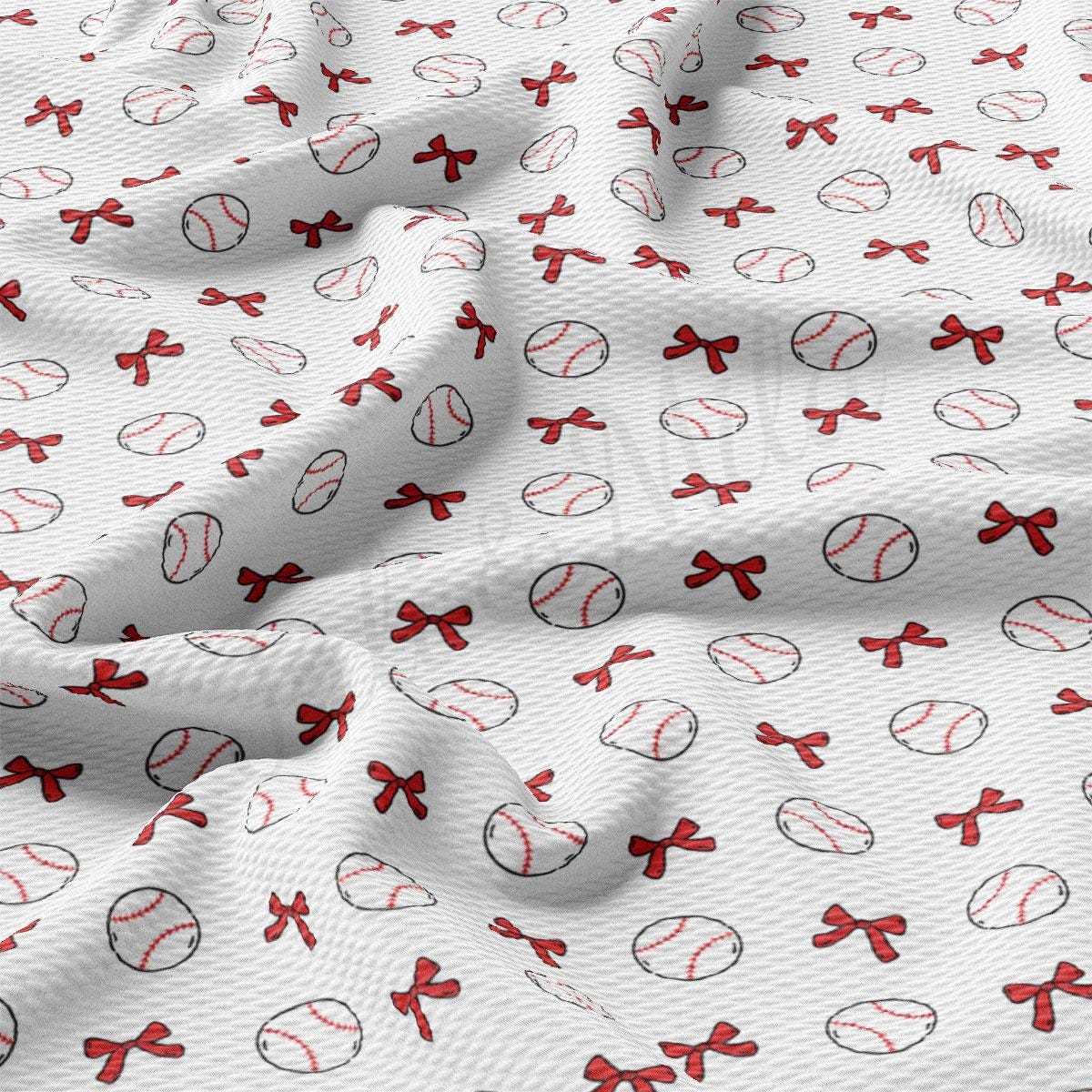 a close up of a baseball pattern on a white fabric
