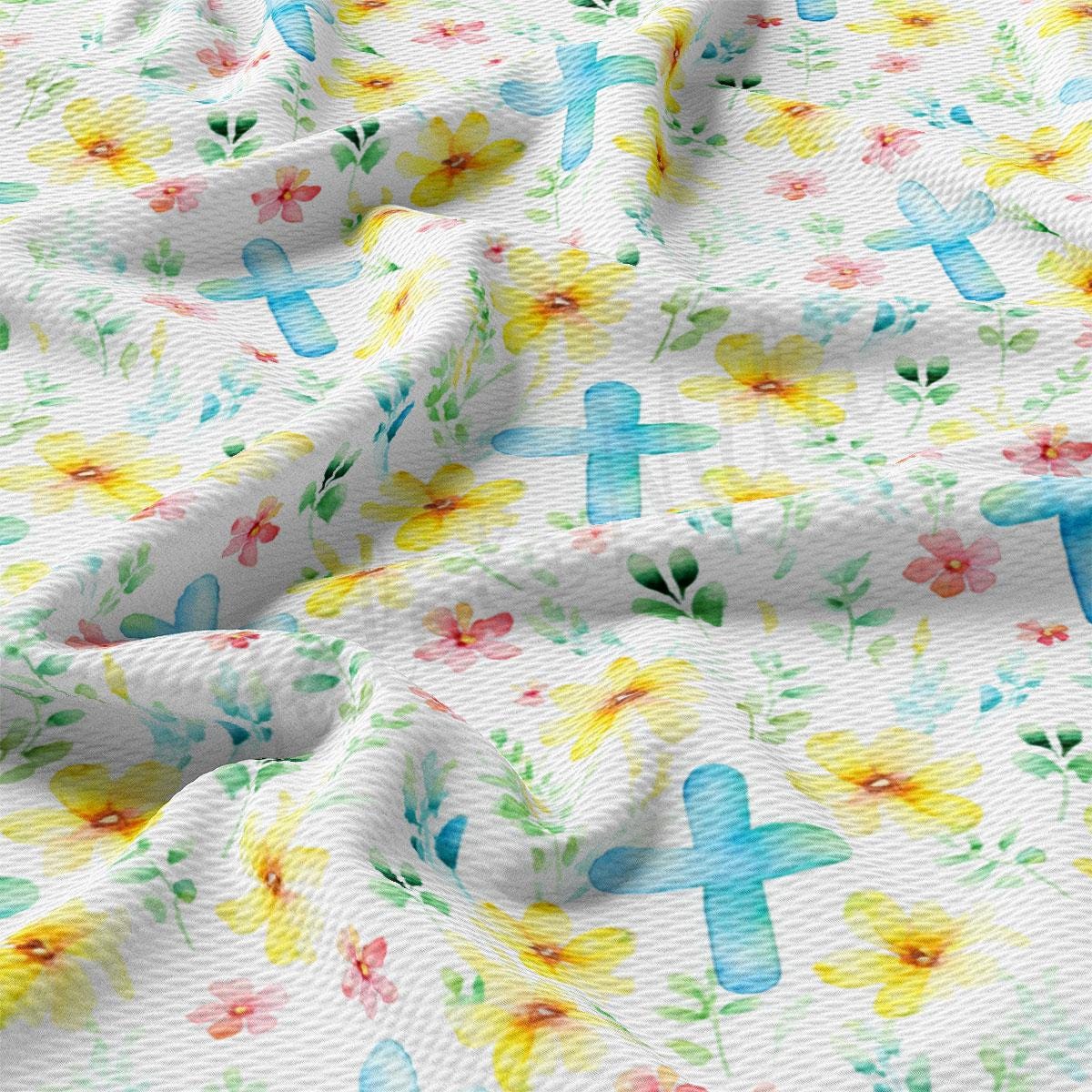 a close up of a white fabric with colorful flowers on it