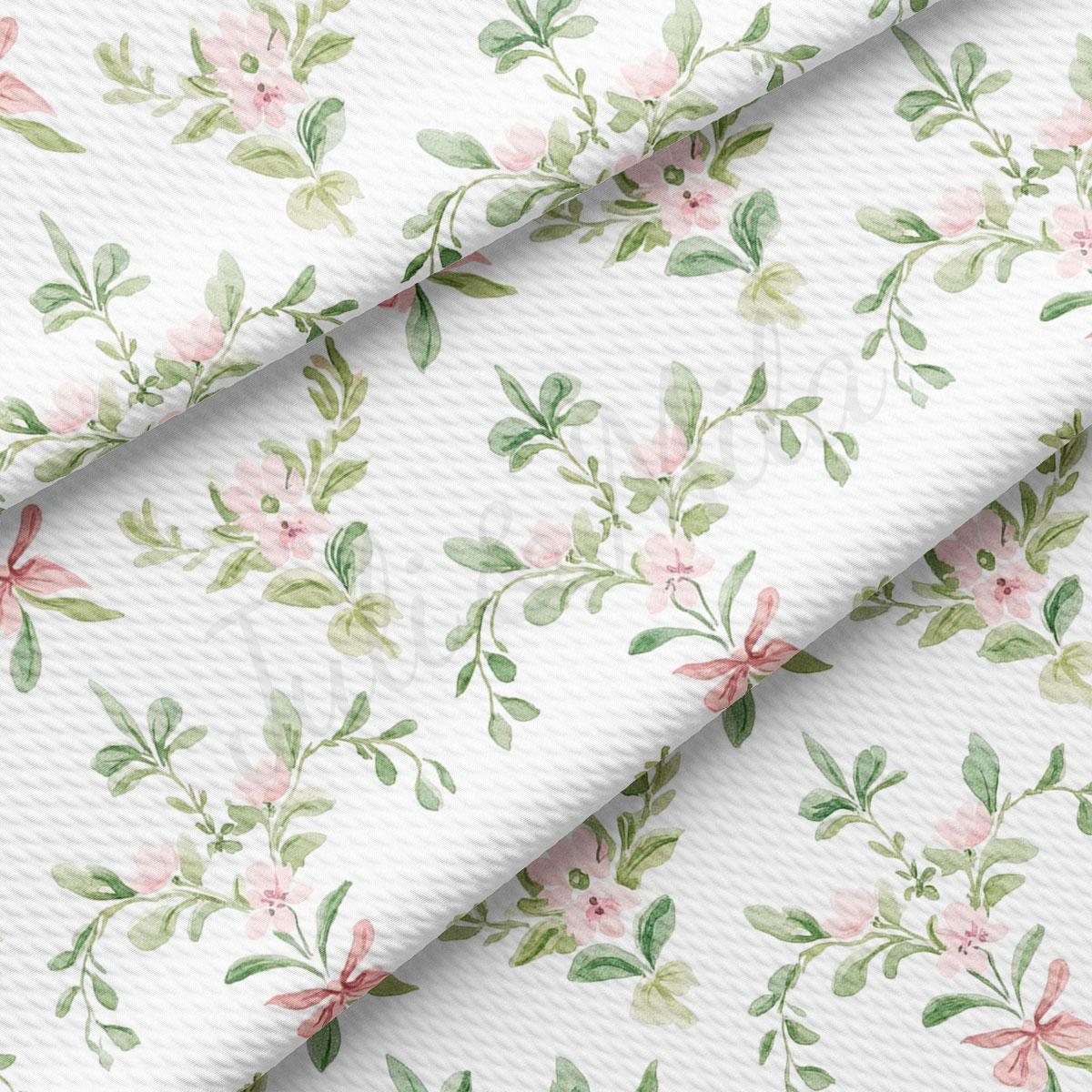 a repeating floral pattern with pink flowers and green leaves on a white background.