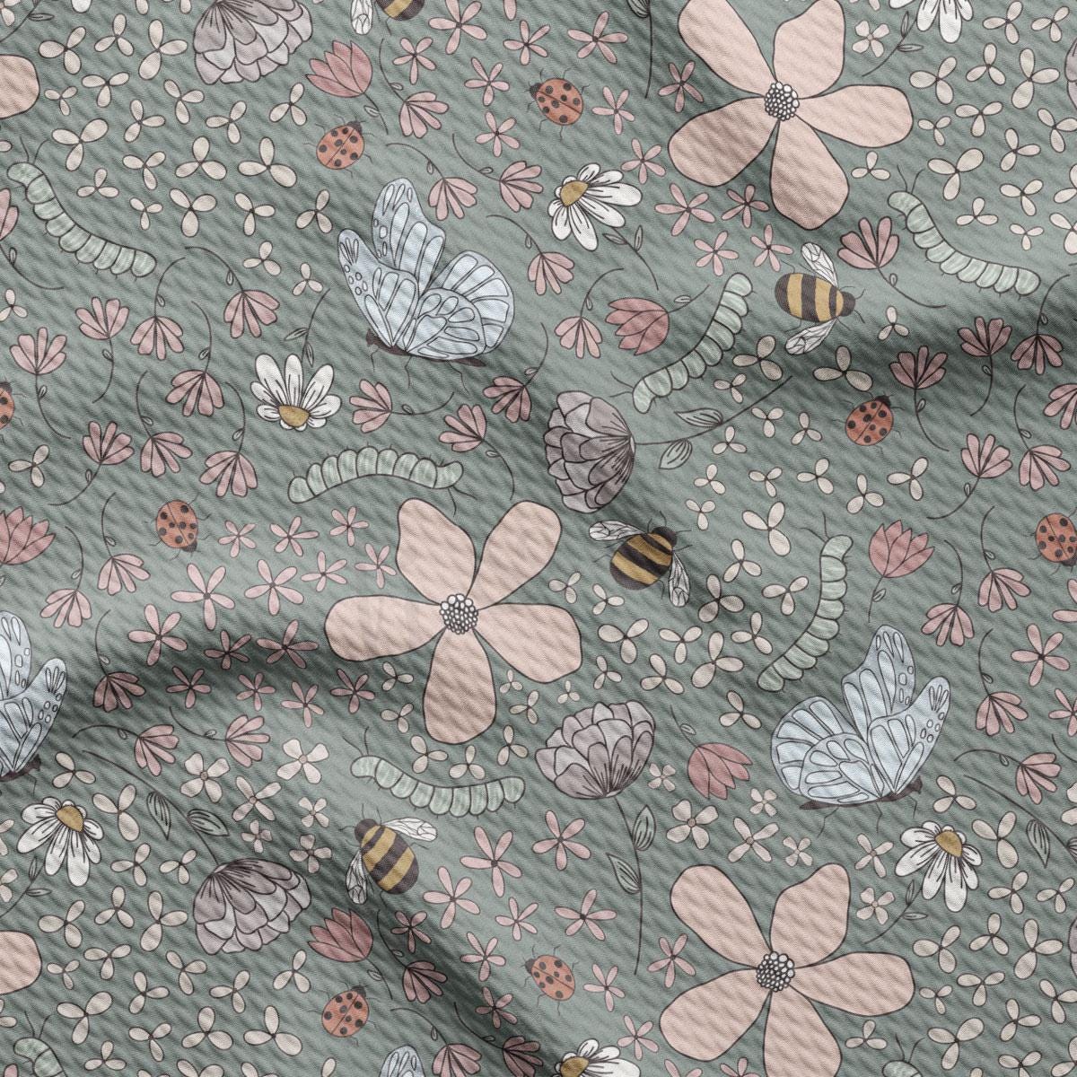a pattern of flowers and bees on a green background