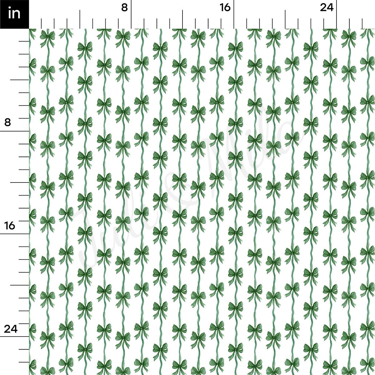 a repeating pattern of green bows on a white background, with the bows arranged in rows and columns. The pattern is composed of a total of 16 bows, and the image is described as a fabric print with a repeating pattern of green bows.