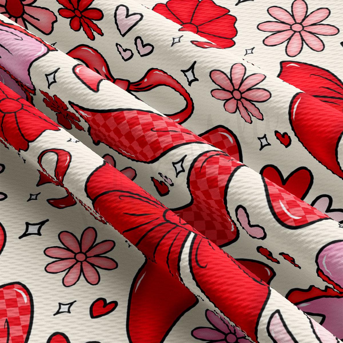 The image is a close-up of a fabric with a repeating pattern of red flowers and hearts on a white background.