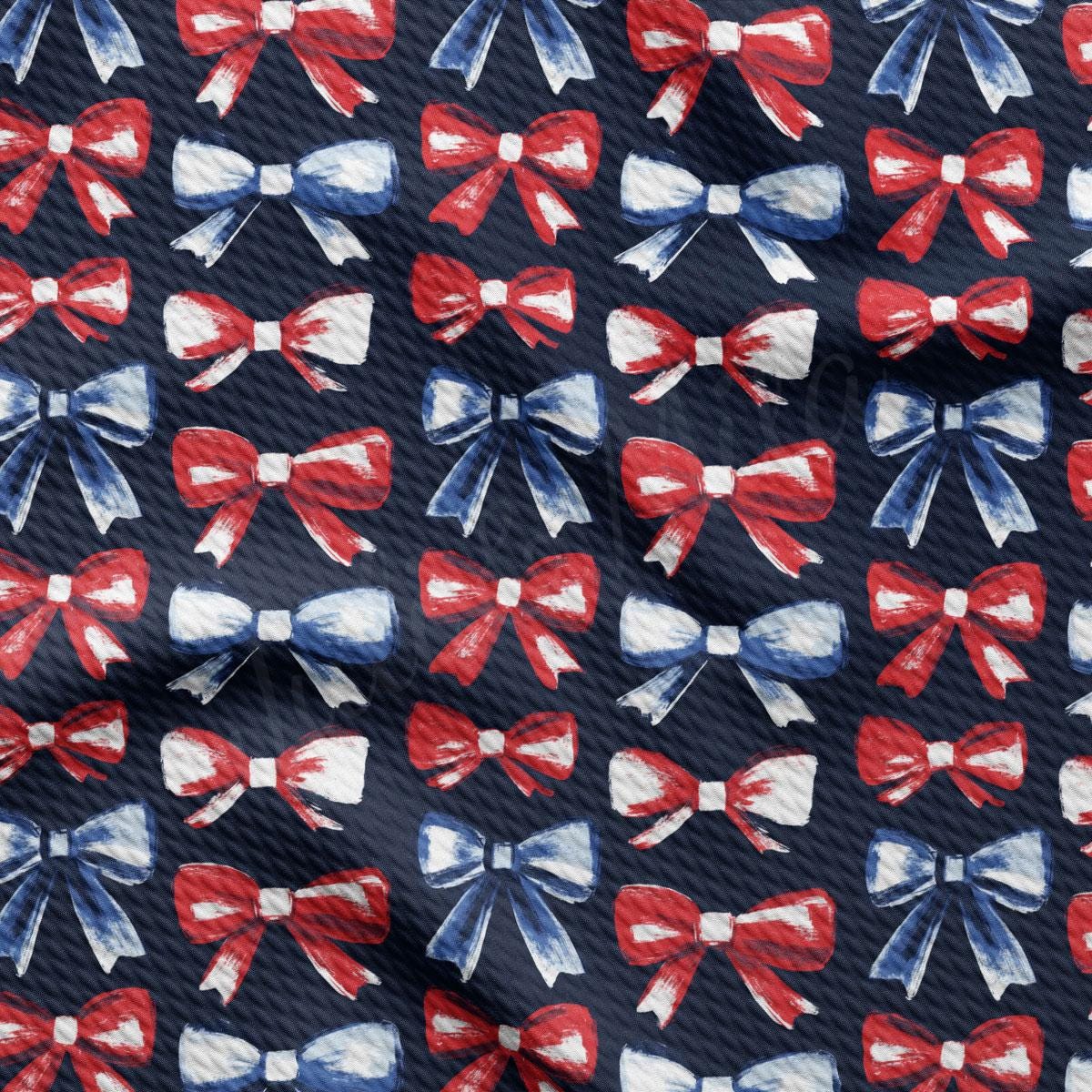 a blue tie with red, white and blue bows on it