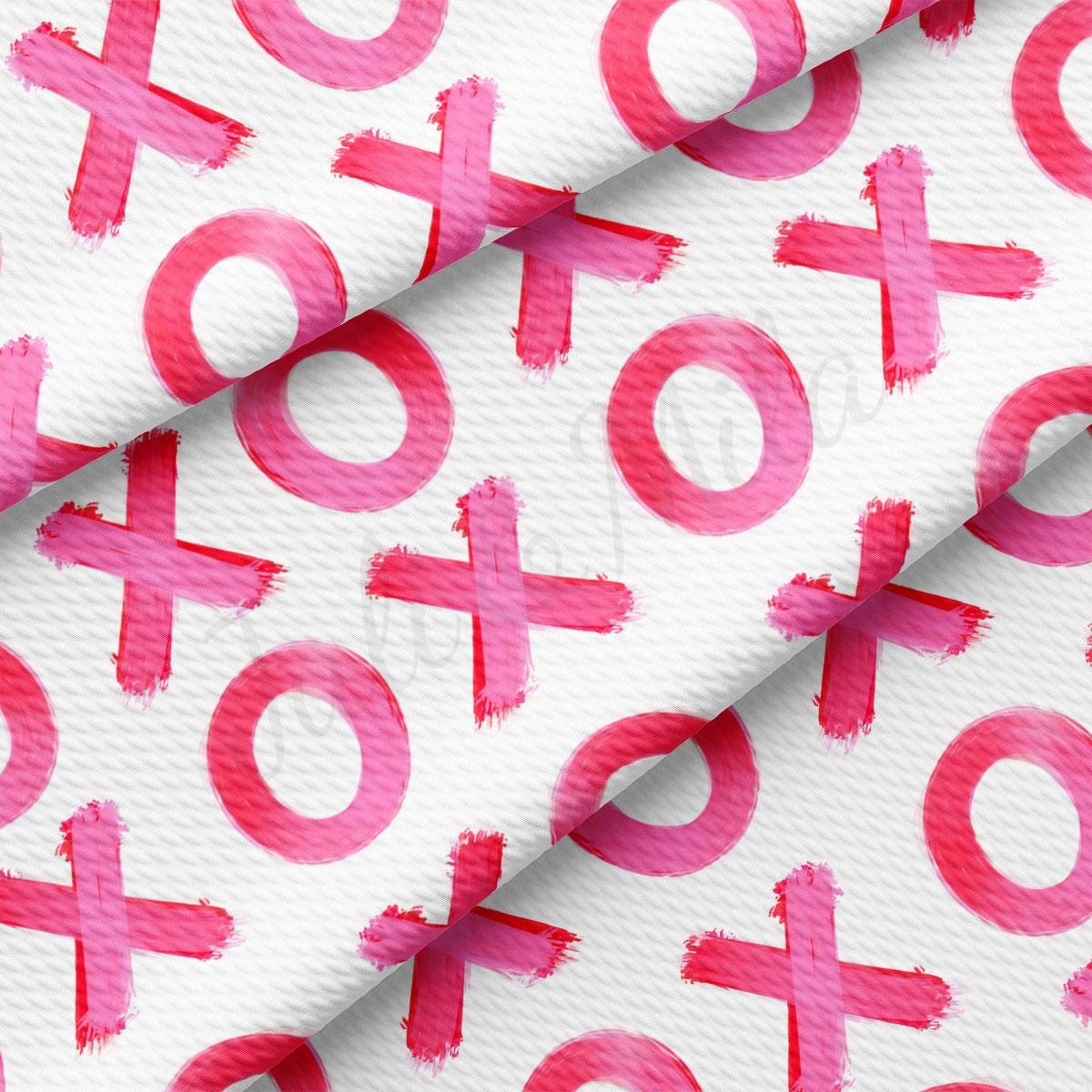 a pattern of pink crosses on white paper