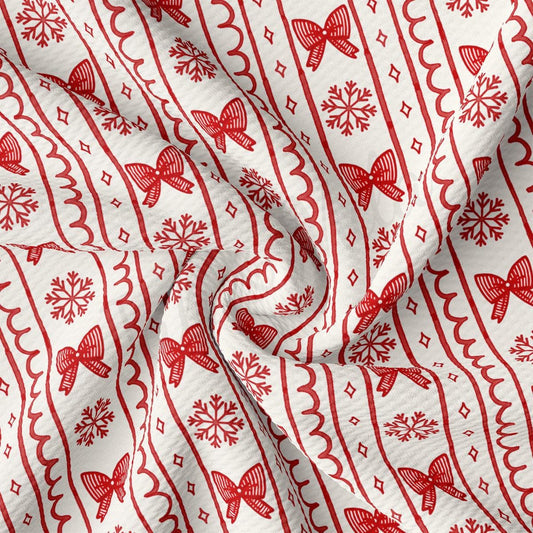 a close-up view of a fabric with a repeating pattern of red bows and snowflakes on a white background.