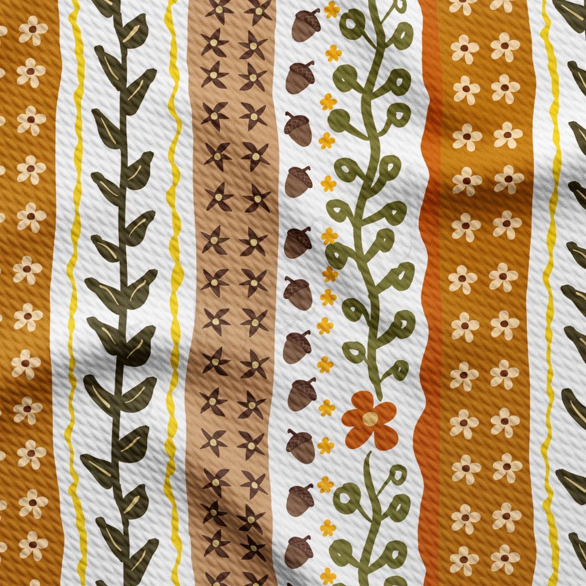 a vibrant and colorful pattern with various elements such as leaves, flowers, and acorns. The pattern consists of vertical stripes in shades of orange, yellow, and brown, with some stripes also featuring leaves and flowers. The overall design is visually appealing and creates a sense of harmony and balance.