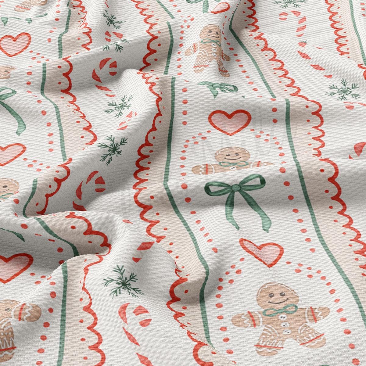 The image is a close-up of a fabric with a repeating pattern of gingerbread man, hearts, and candy canes.
