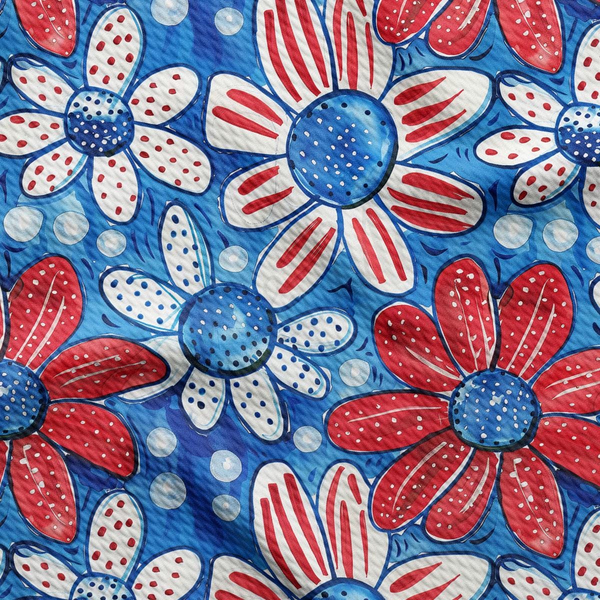 a red, white, and blue fabric with flowers on it
