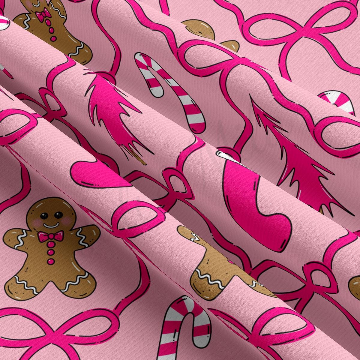 a close-up view of a fabric with a repeating pattern of pink ribbons and gingerbread man figures.