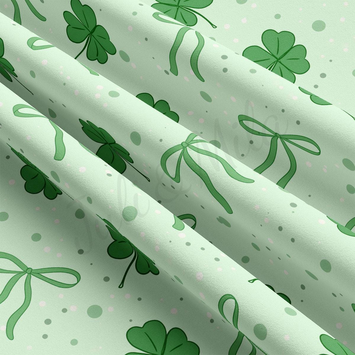 a green and white background with shamrocks on it