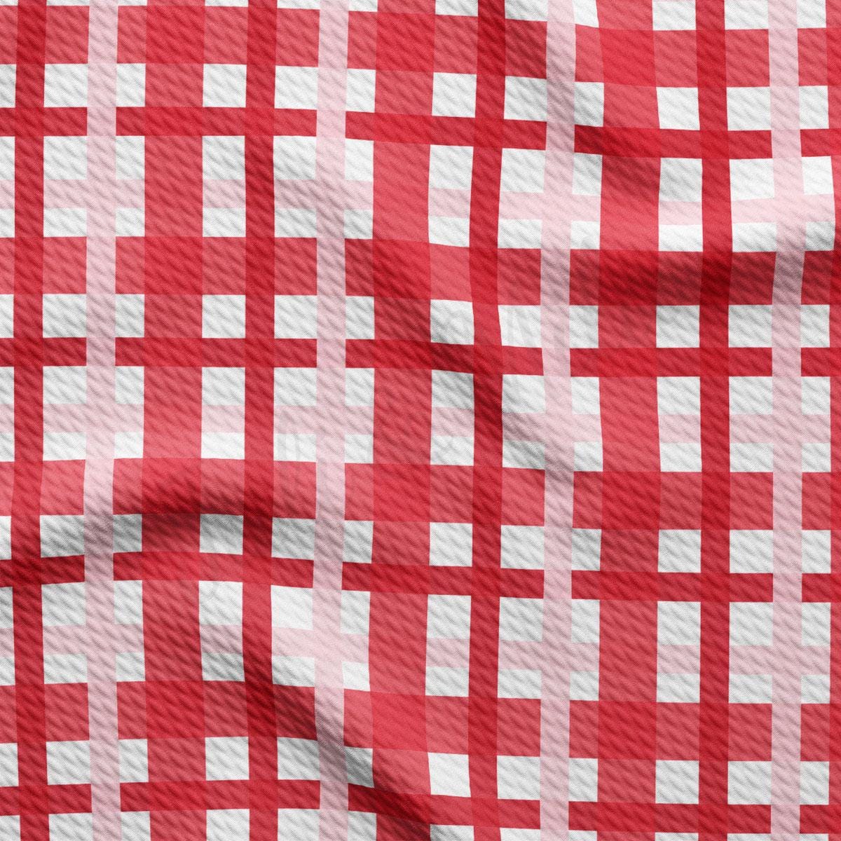 a red and white checkered fabric with white squares
