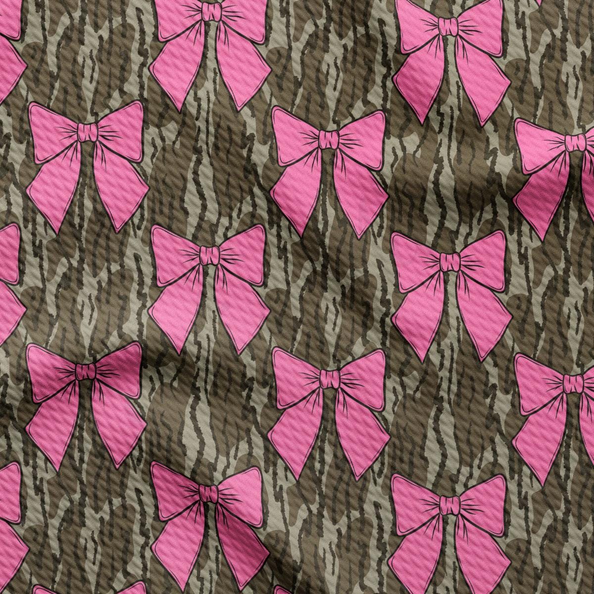 a pattern of pink bows on a brown background