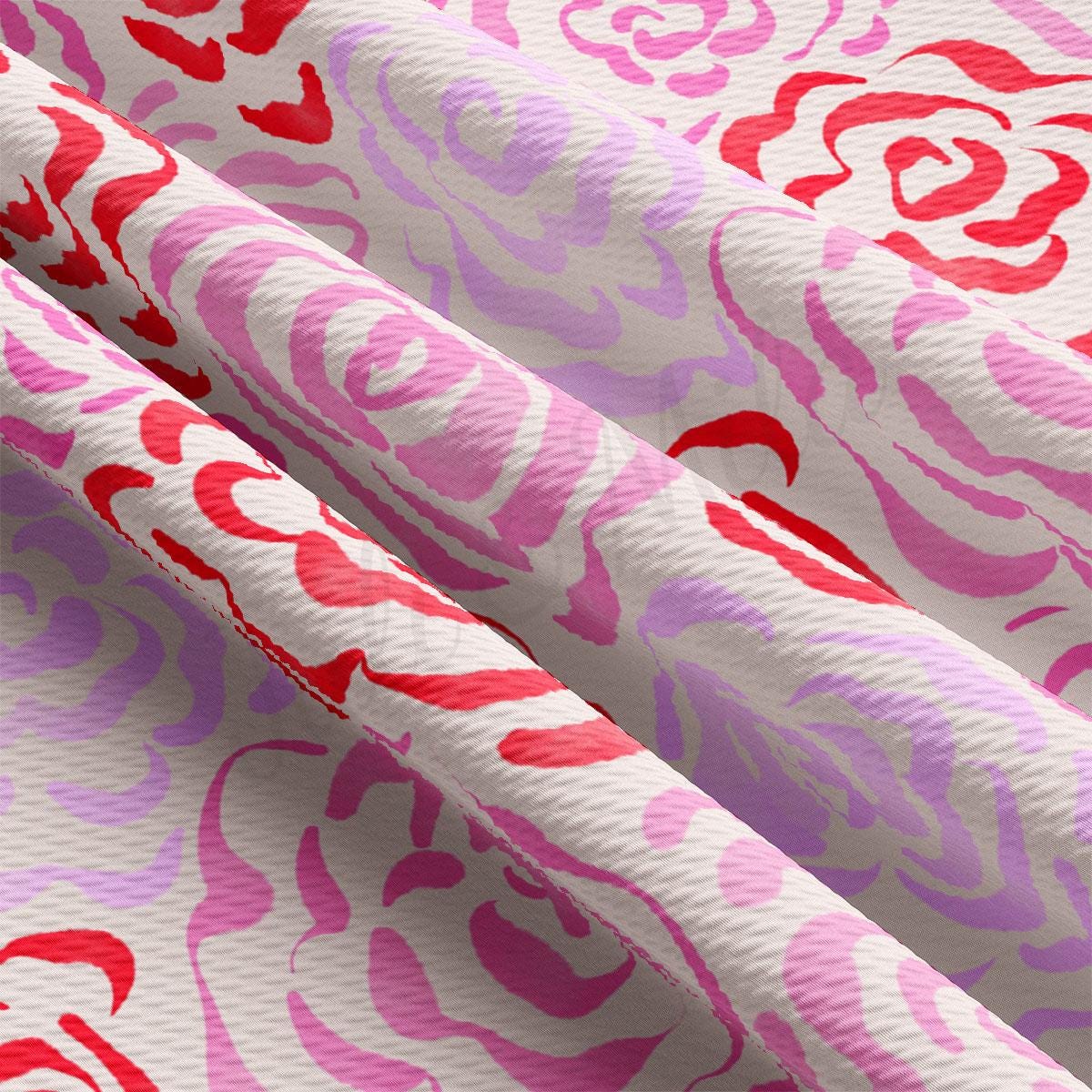 a close up of a pink and red fabric