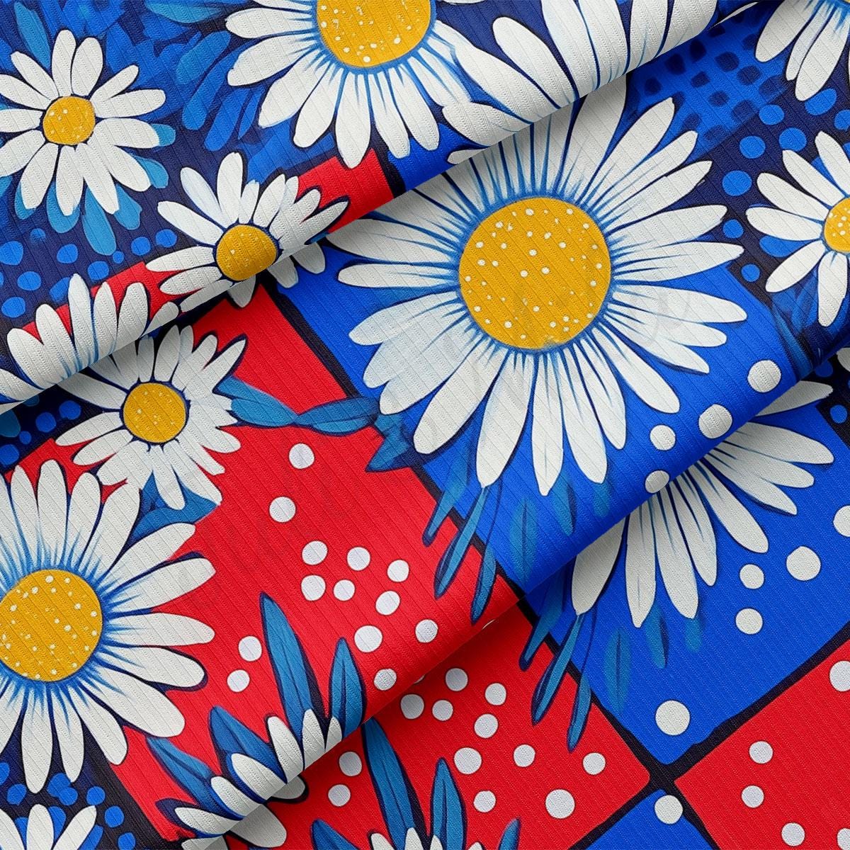a red, white, and blue fabric with daisies on it