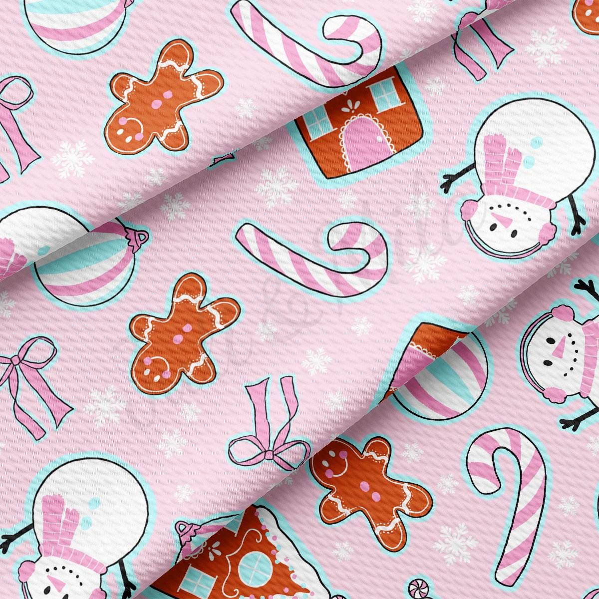 a pink background with a pattern of christmas items