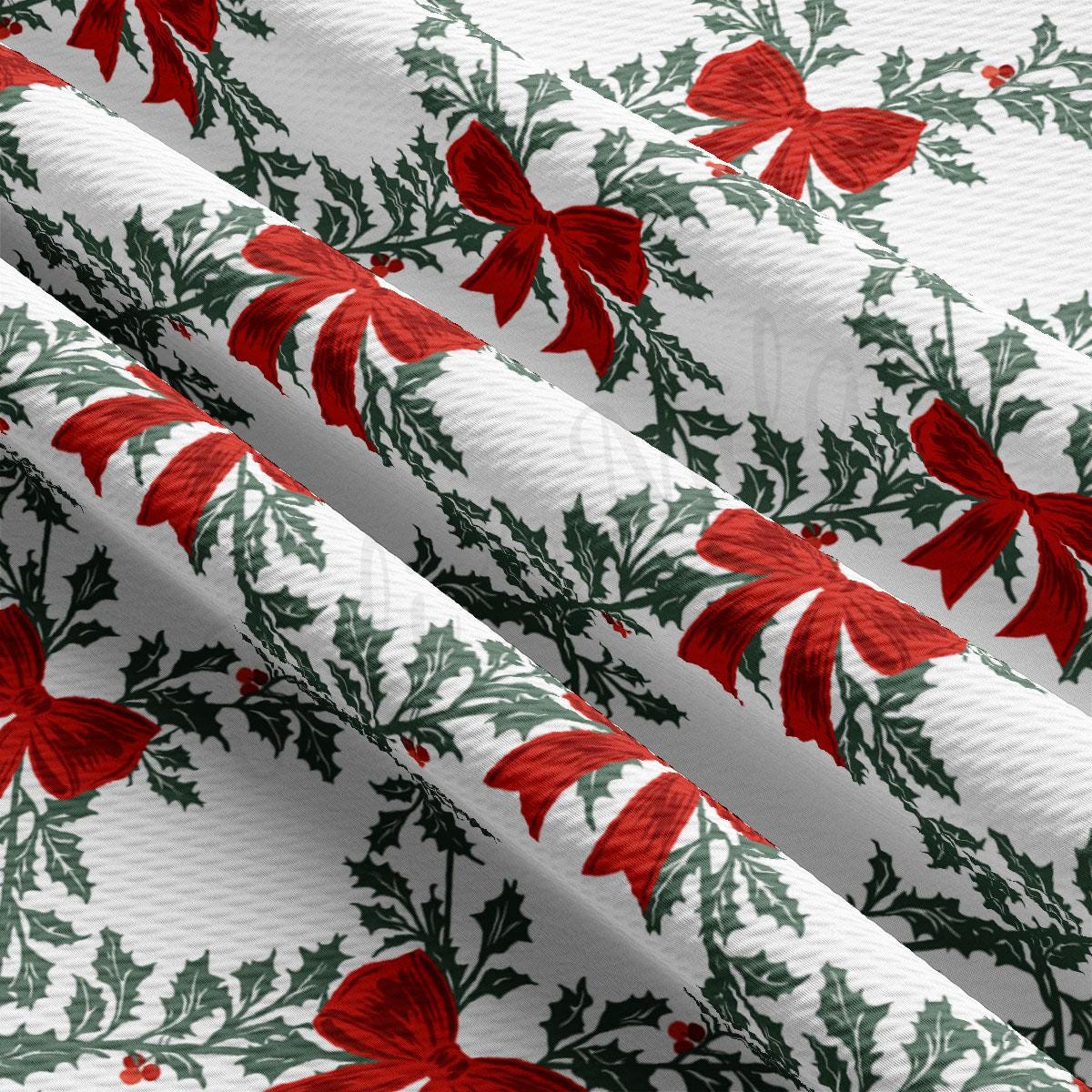 a close-up view of a fabric with a repeating pattern of red bows and holly leaves on a white background.