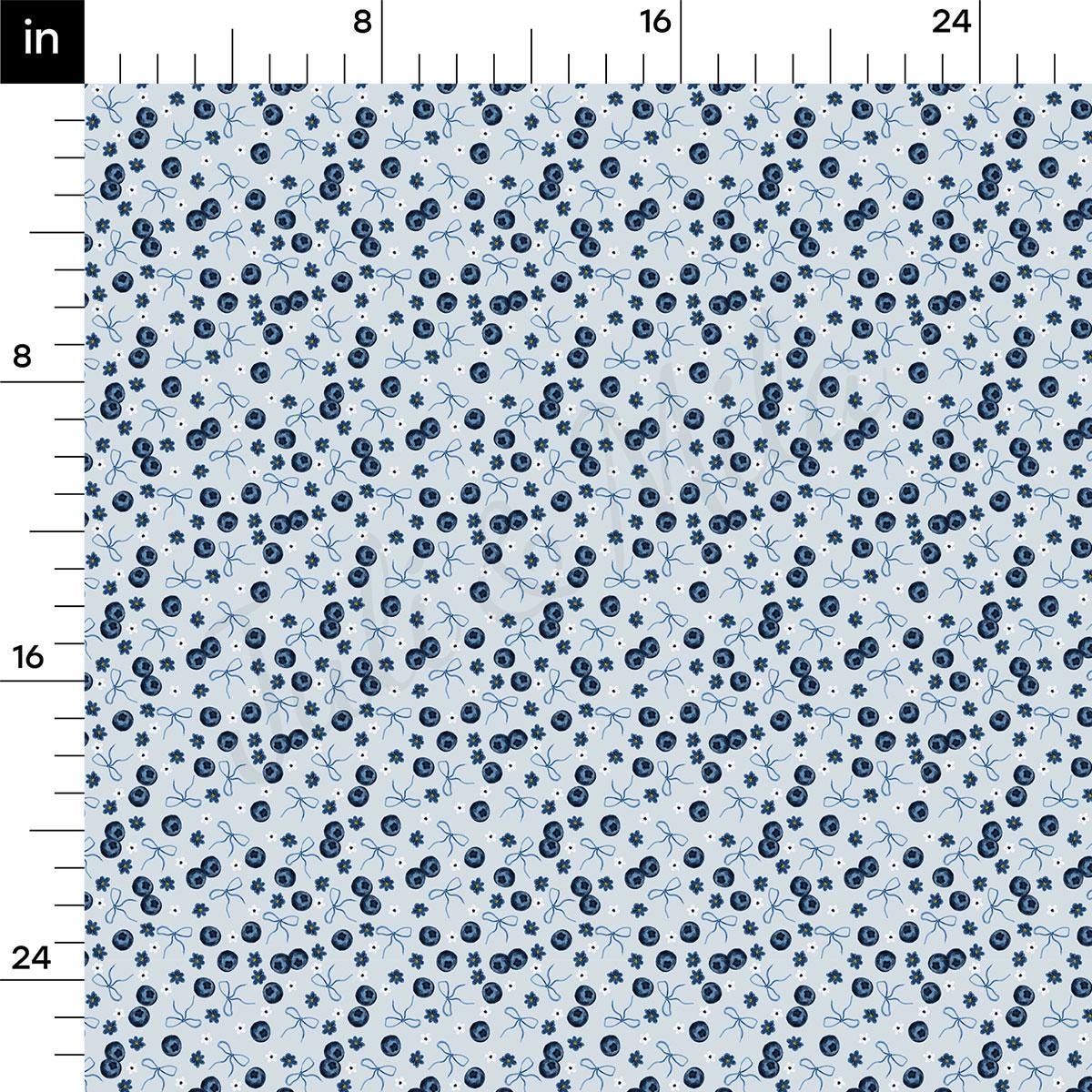 a blue and white pattern with a ruler in front of it