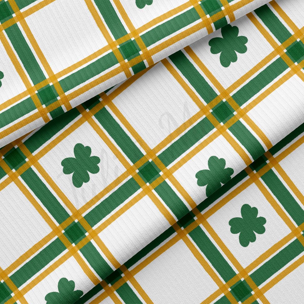 a green and white plaid with shamrocks on it