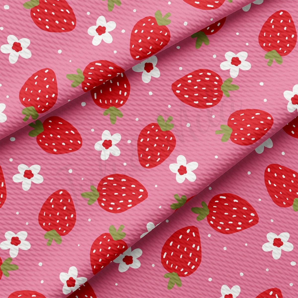 a pink background with strawberries and daisies